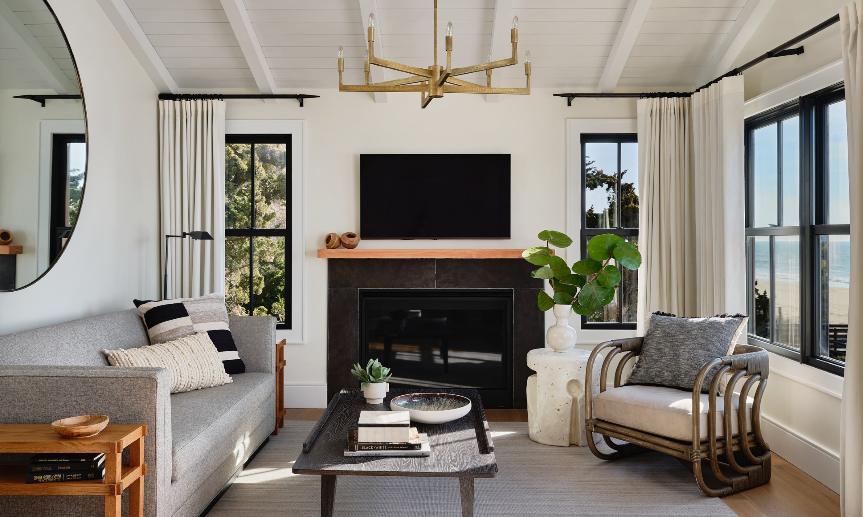 Living room with couch, chair, coffee table and television.