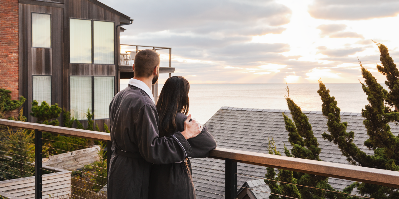 A couple in robes overlooks the view at Gurney's Montauk Resort